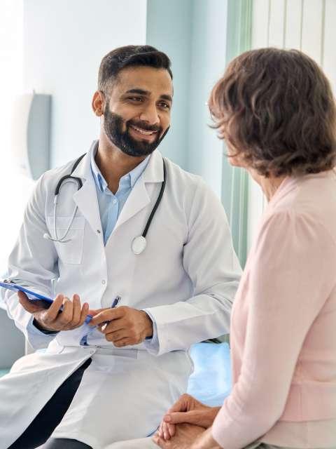 Doctor consulting with cancer patient